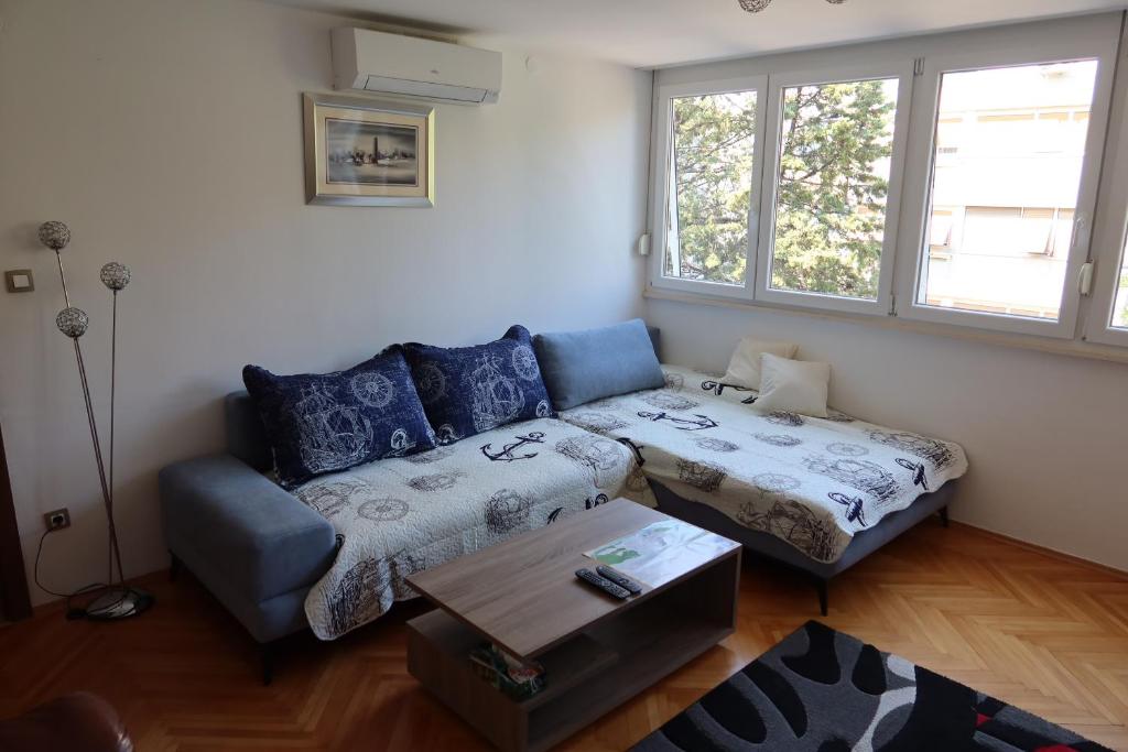 a living room with a couch and a coffee table at Apartment Mia in Split