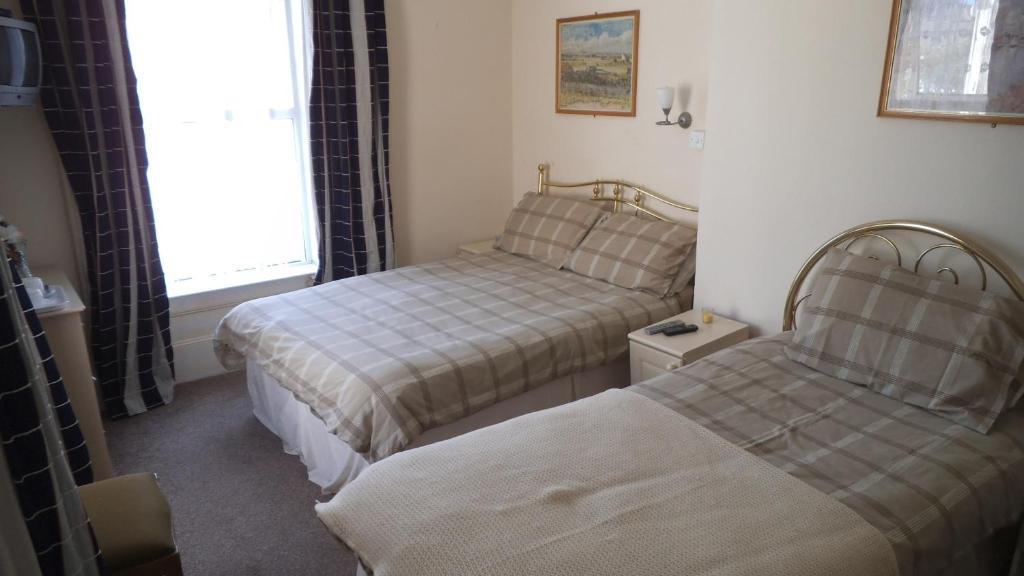 Postel nebo postele na pokoji v ubytování Thalatta Guest House