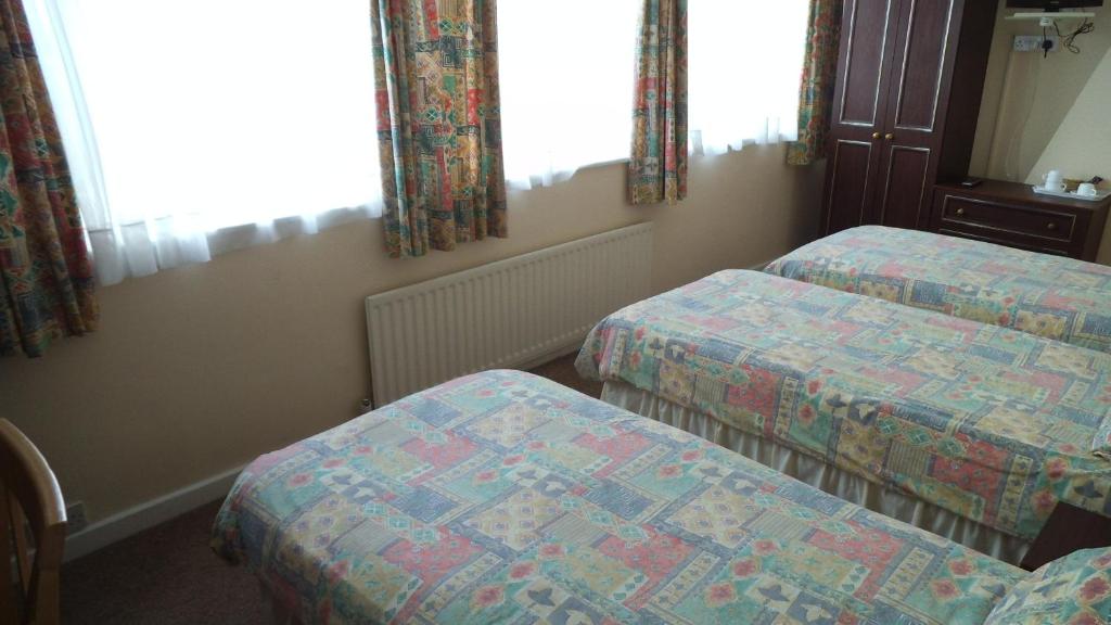 Postel nebo postele na pokoji v ubytování Thalatta Guest House