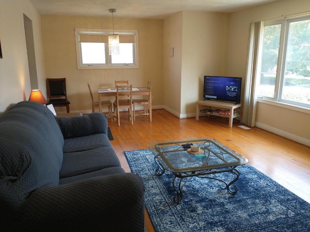 a living room with a couch and a table at Barrie North Retreat - Quiet and Friendly in Barrie