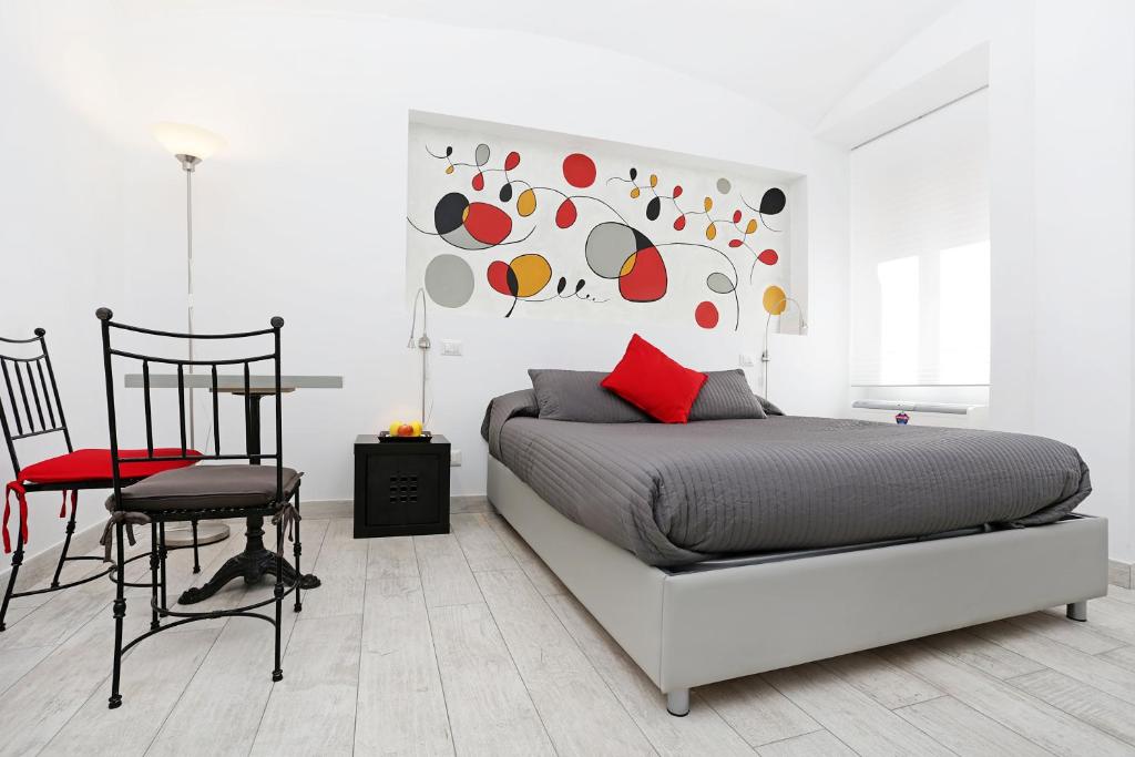 Un pat sau paturi într-o cameră la Houspitality Nero Bed & Breakfast