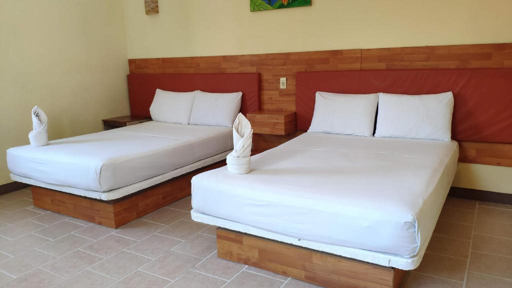 Postel nebo postele na pokoji v ubytování Hotel Cañada Internacional