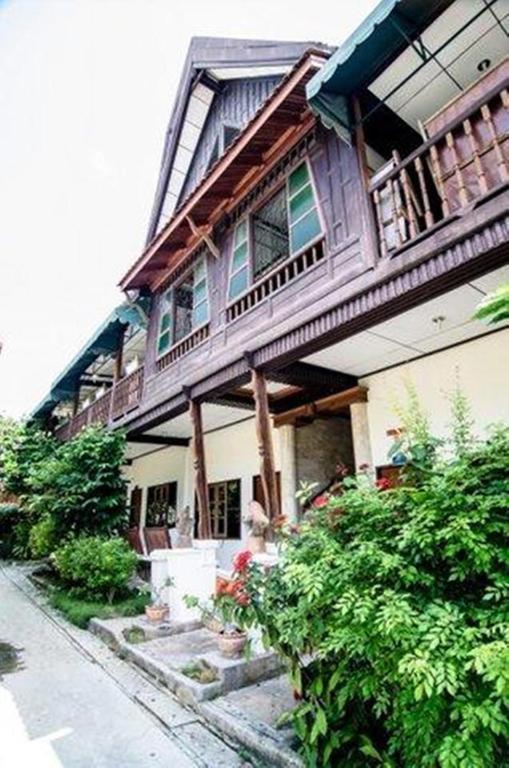 a large house with a balcony on top of it at Sea Garden Resort & Spa, Haadrin in Haad Rin