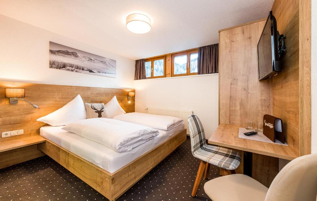 Postel nebo postele na pokoji v ubytování Landhaus Moosbrugger