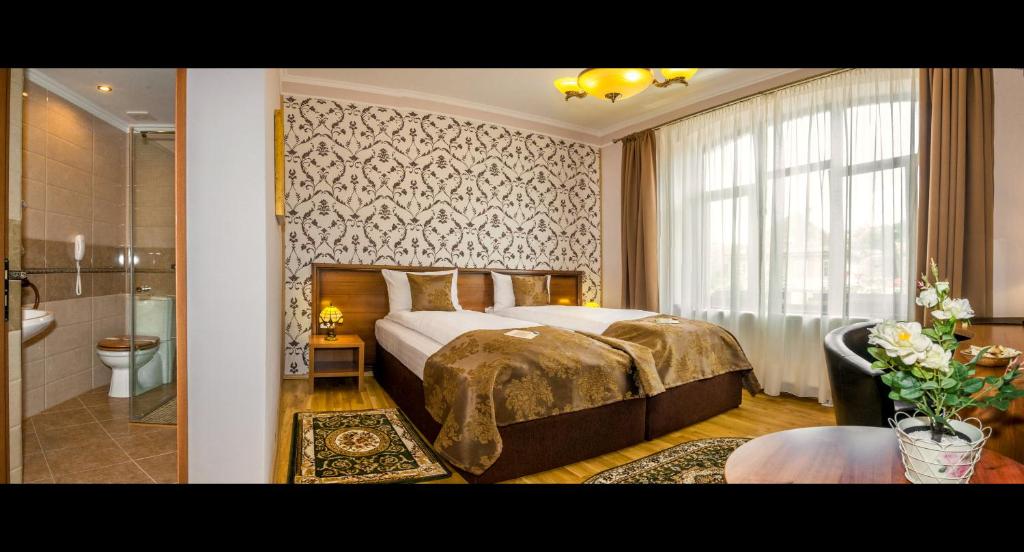 Postel nebo postele na pokoji v ubytování Hotel Boutique Bulevard