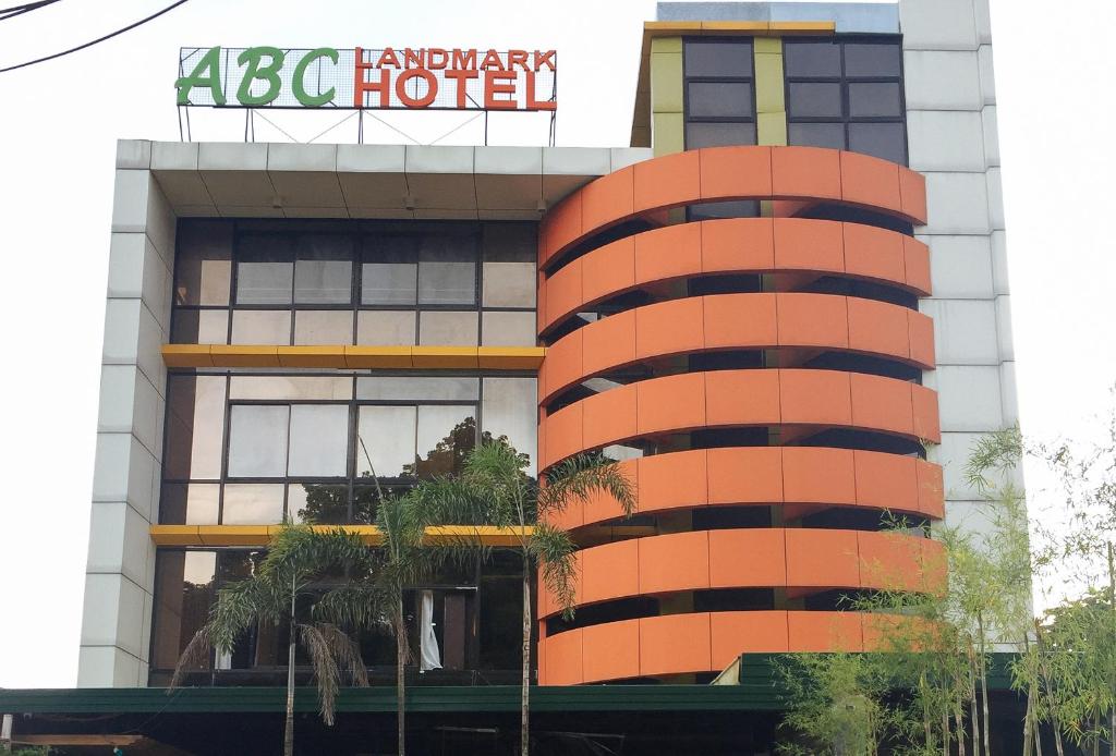 um edifício com um sinal em cima em RedDoorz Plus @ ABC Landmark Hotel em Kidapawan