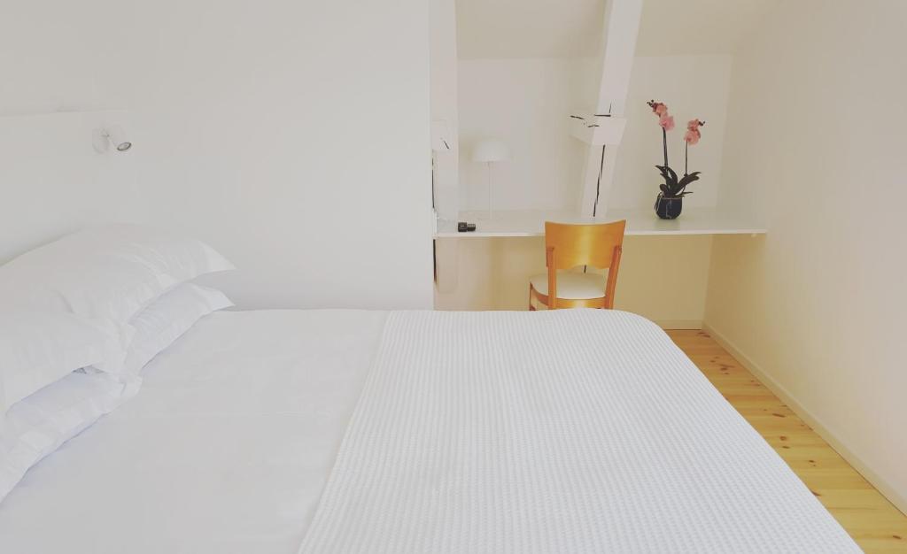 Postel nebo postele na pokoji v ubytování Prästgården Hotell & Bryggeri