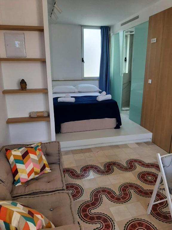 A bed or beds in a room at Bonito estudio en el centro de Valencia