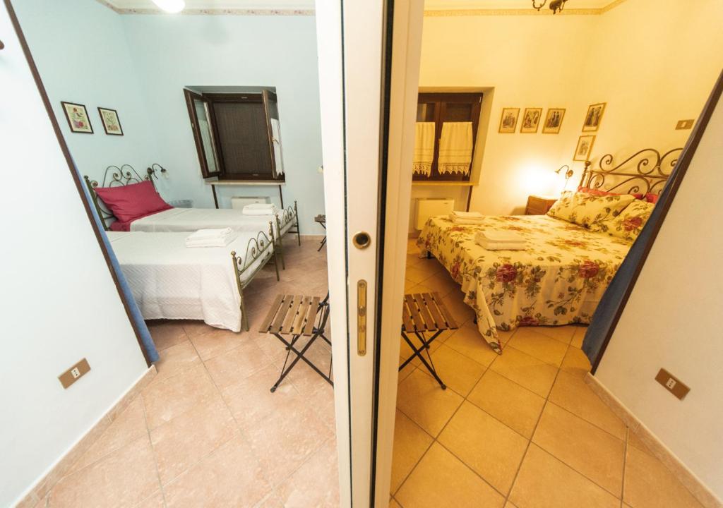 Łóżko lub łóżka w pokoju w obiekcie Il Sorgituro - Agriturismo