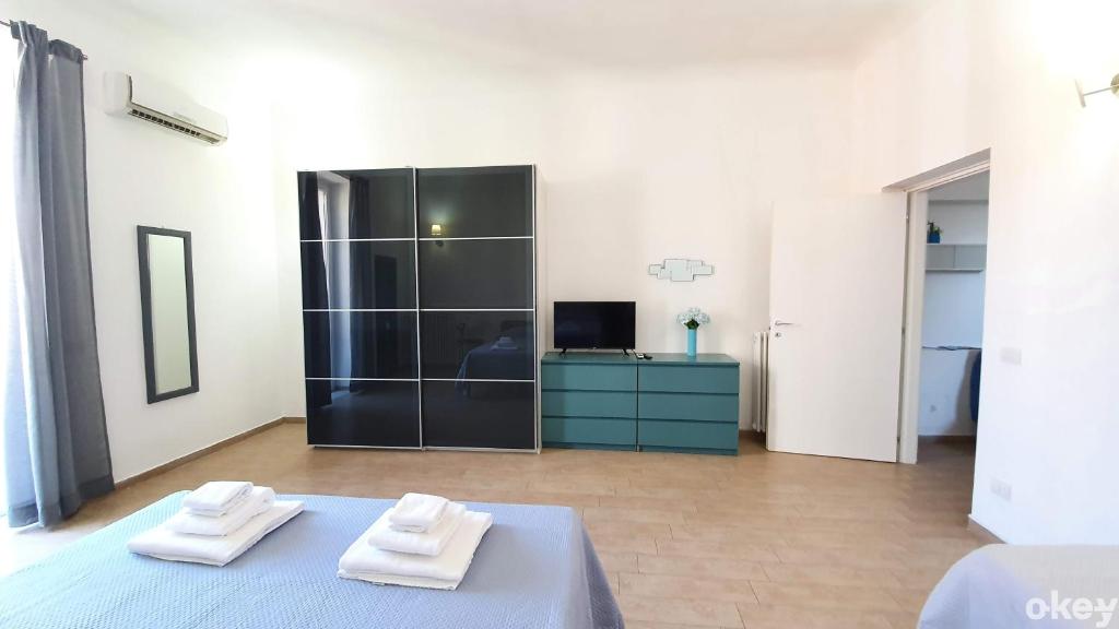 Łóżko lub łóżka w pokoju w obiekcie Domus Garruba - Casa Vacanze Bari
