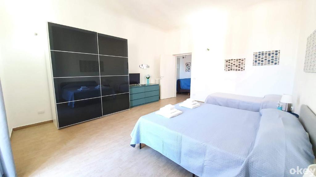 Łóżko lub łóżka w pokoju w obiekcie Domus Garruba - Casa Vacanze Bari