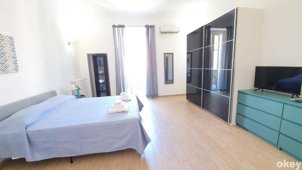 Łóżko lub łóżka w pokoju w obiekcie Domus Garruba - Casa Vacanze Bari