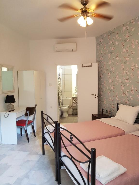 Postel nebo postele na pokoji v ubytování Nomads Rooms