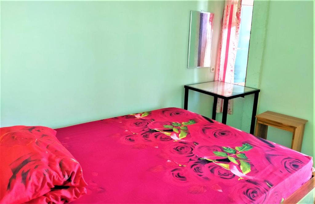 Letto o letti in una camera di Kendang Kempul Hostel