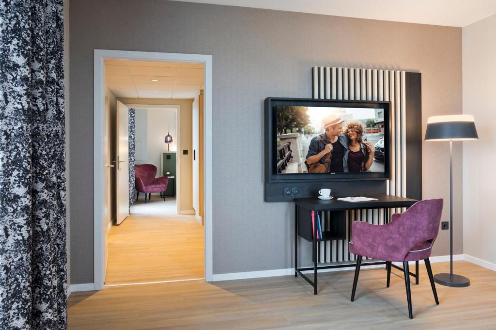 TV a/nebo společenská místnost v ubytování Citadines Eurometropole Strasbourg