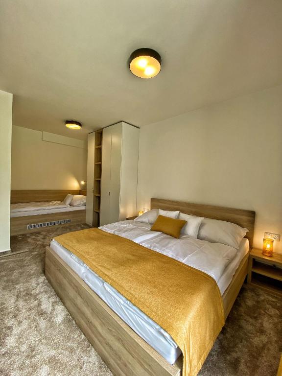 Postel nebo postele na pokoji v ubytování Apartments Severka - Jasná