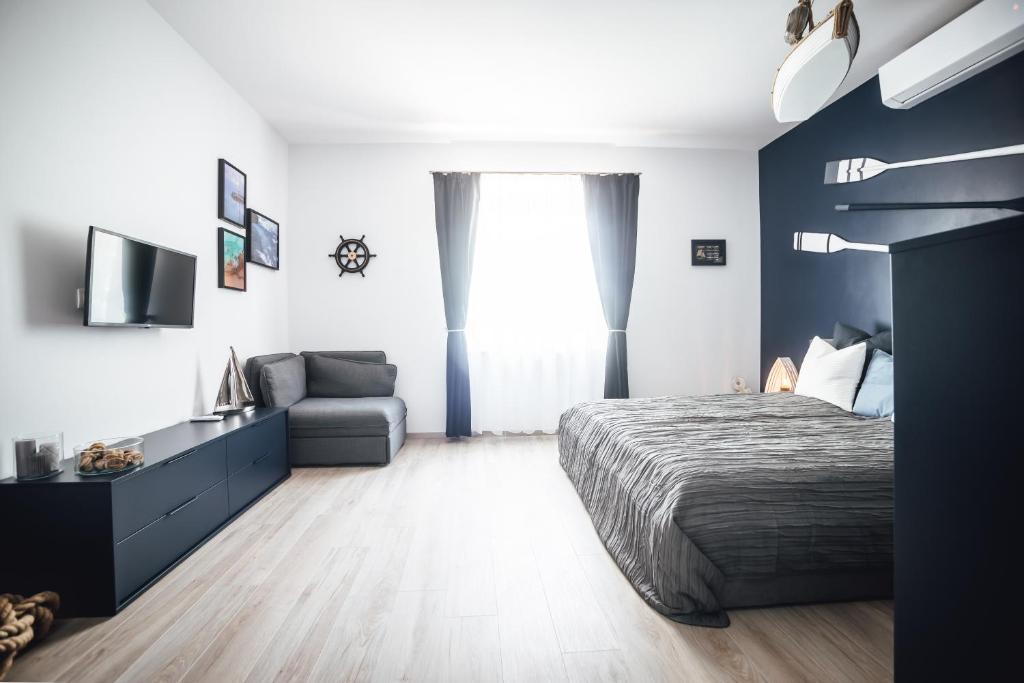 Łóżko lub łóżka w pokoju w obiekcie Élmény Balaton Hotel