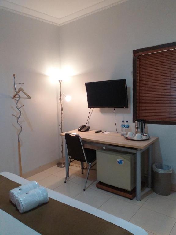 TV a/nebo společenská místnost v ubytování BLESSING RESIDENCE HOTEL