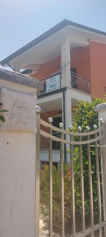 a building with a fence in front of it at Villa Corte at Via Roma - Apartments with a View in Villa Latina