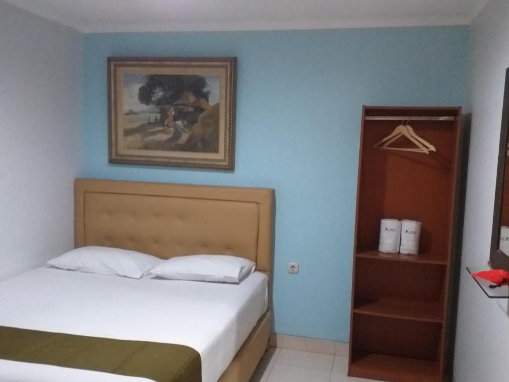 Postel nebo postele na pokoji v ubytování BLESSING RESIDENCE HOTEL