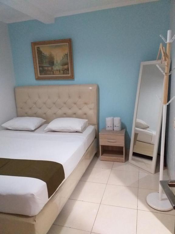 Postel nebo postele na pokoji v ubytování BLESSING RESIDENCE HOTEL