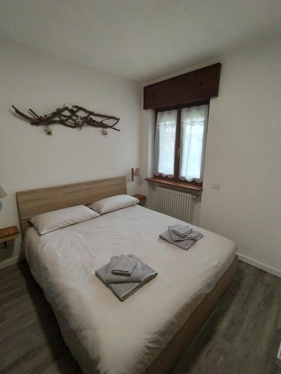 Postel nebo postele na pokoji v ubytování Solimmo