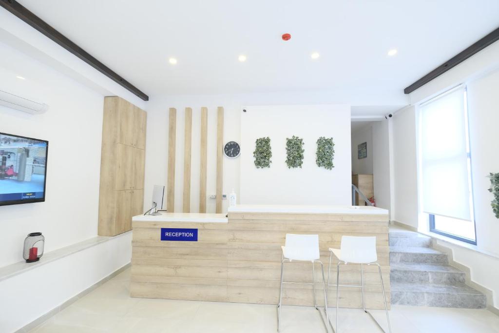 TV a/nebo společenská místnost v ubytování Tut Hotel