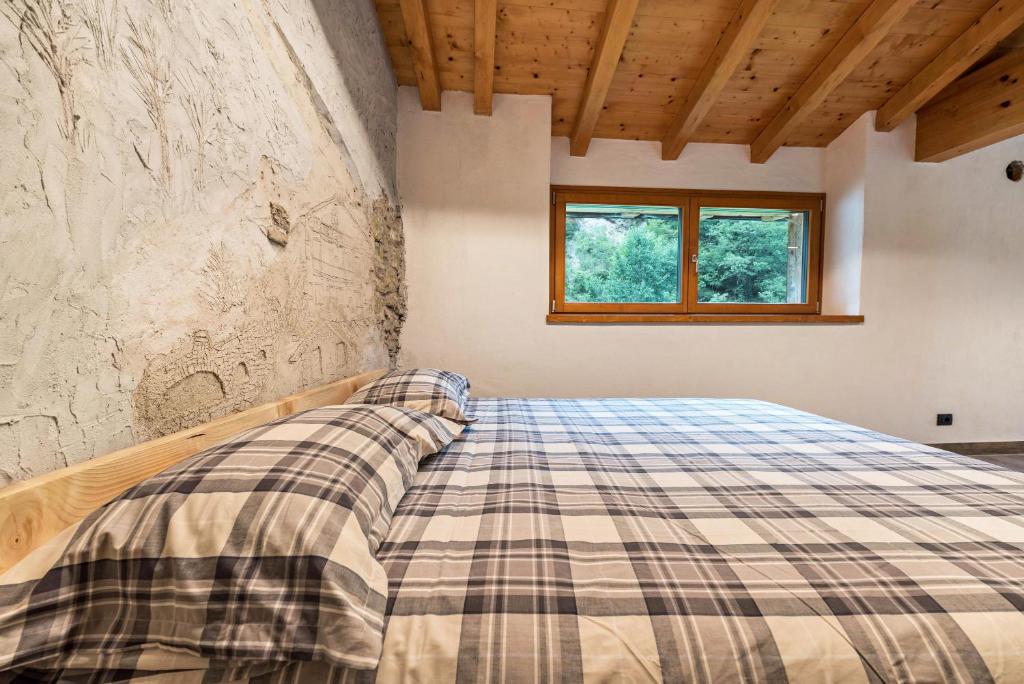 Łóżko lub łóżka w pokoju w obiekcie Casa al mulino