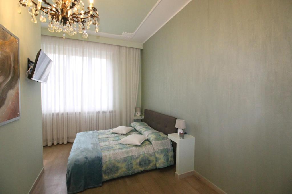 Postel nebo postele na pokoji v ubytování Ad Astra Rooms