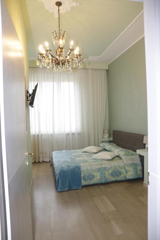 Postel nebo postele na pokoji v ubytování Ad Astra Rooms