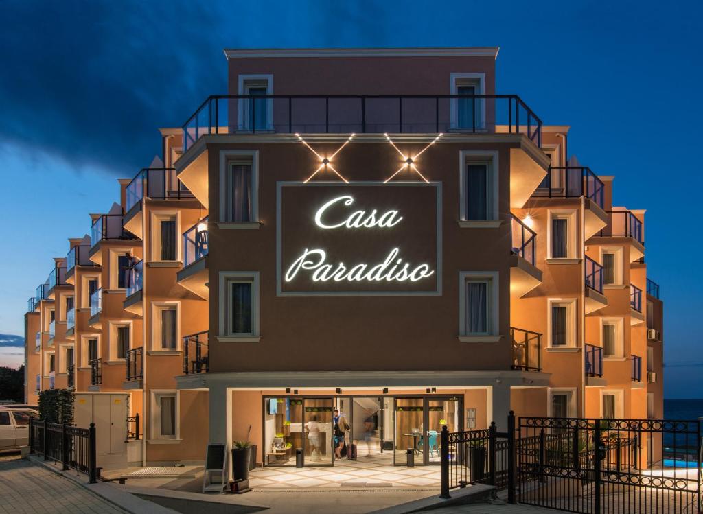 a building with a sign that reads casa palacio at Casa Paradiso Beach Residence in Ahtopol