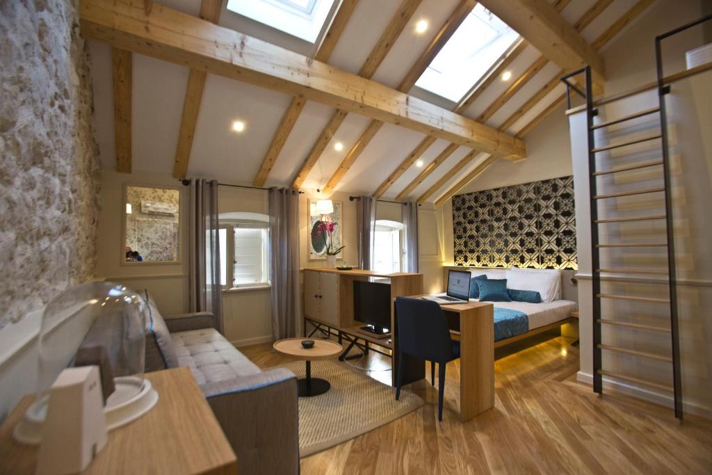 Postel nebo postele na pokoji v ubytování Borelli Palace & Borelli Blue