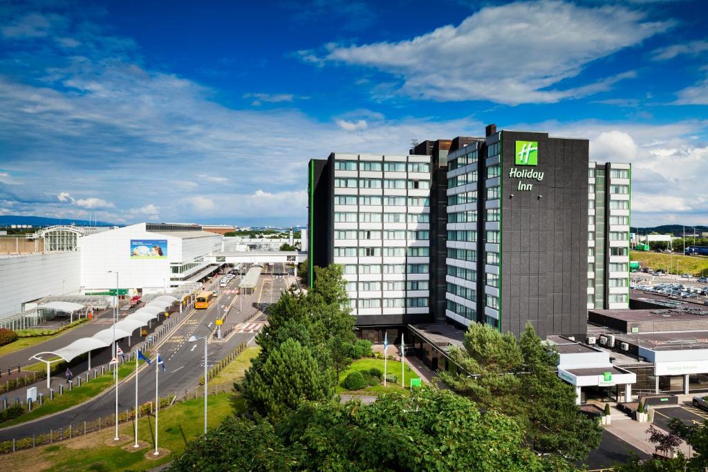 a building with a sign on the side of it at Holiday Inn - Glasgow Airport by IHG in Paisley