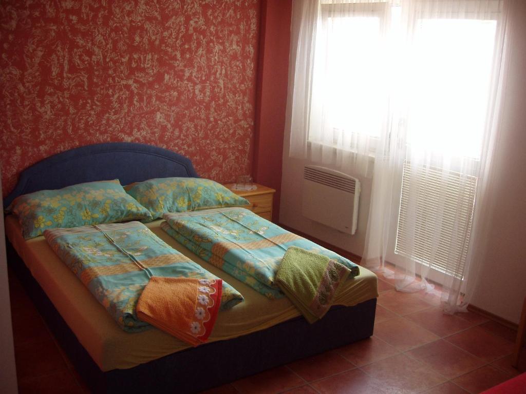 Postel nebo postele na pokoji v ubytování Penzion Orion Hovorany