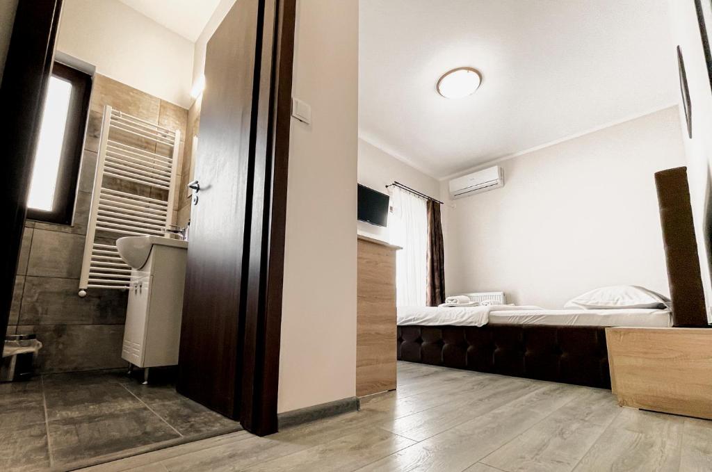 Postel nebo postele na pokoji v ubytování Pensiunea Balkan