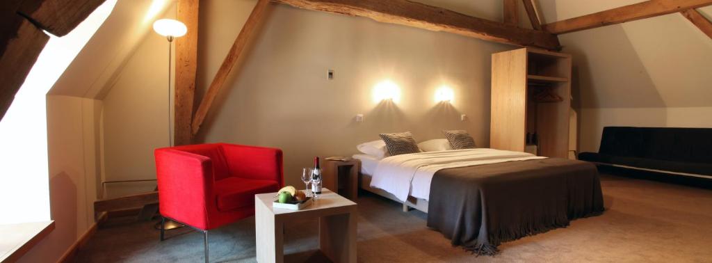 Ένα ή περισσότερα κρεβάτια σε δωμάτιο στο Hotel The Lodge Heverlee