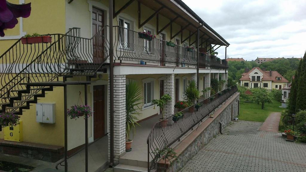 a building with a staircase on the side of it at Gościniec Mazurski in Mrągowo