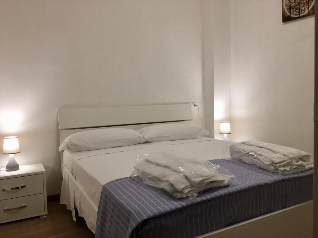 Ліжко або ліжка в номері La Terrazza Del Duca
