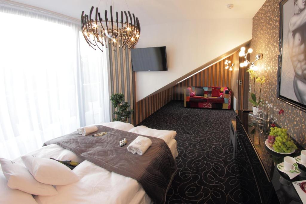 Postel nebo postele na pokoji v ubytování Alex Palace