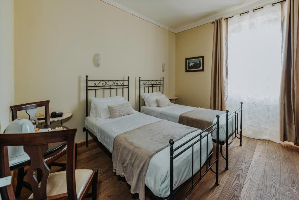 Postel nebo postele na pokoji v ubytování Il Castello di Bubbio