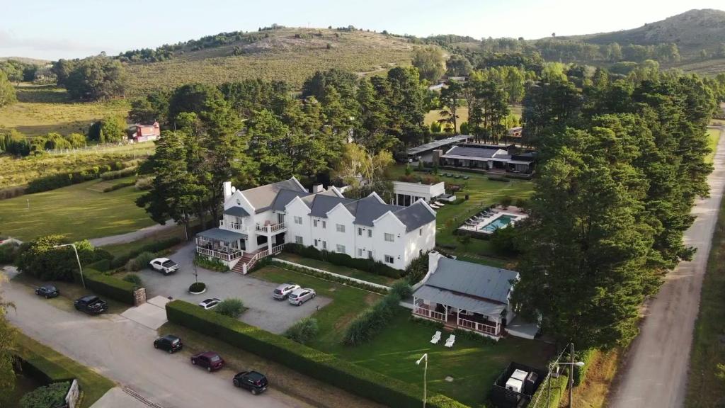 an aerial view of a large white house at Posada La Protegida in Tandil