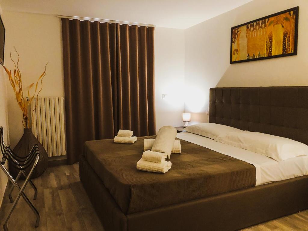 Posteľ alebo postele v izbe v ubytovaní Attico Danivinci