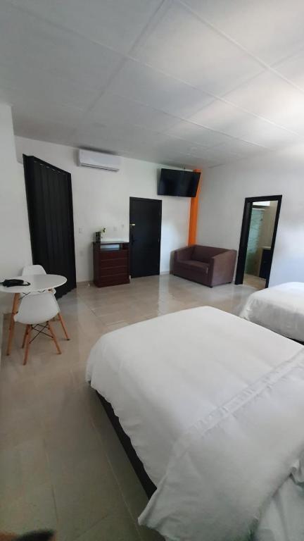 Postel nebo postele na pokoji v ubytování Hotel boutique turquesa