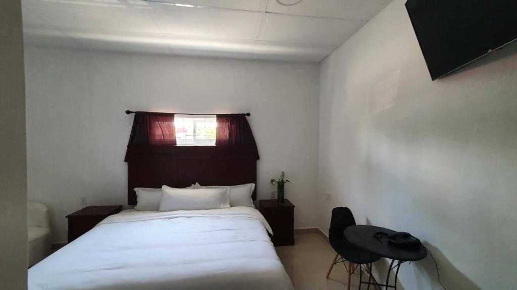 Postel nebo postele na pokoji v ubytování Hotel boutique turquesa