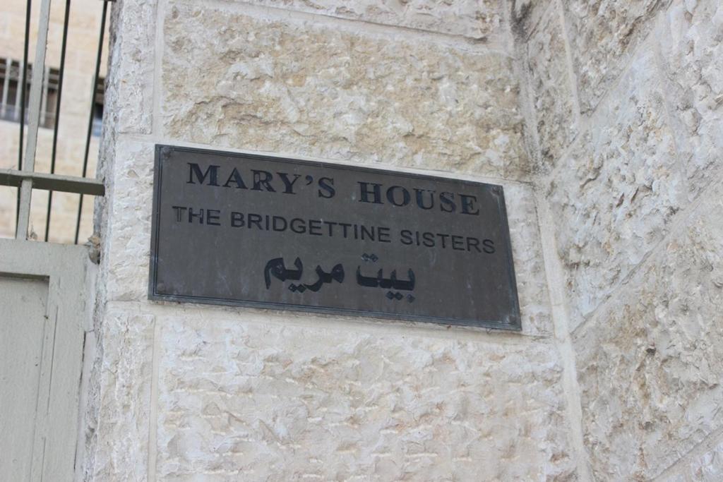 a sign on the side of a building at Mary's House in Bethlehem
