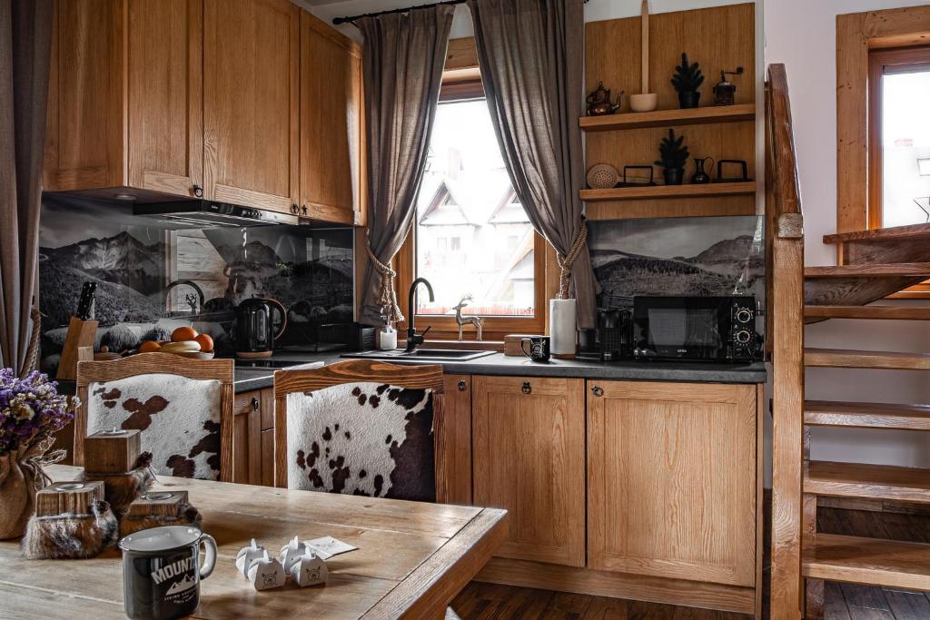 Kuchyň nebo kuchyňský kout v ubytování Nosalowski Wypas Jacuzzi & Sauna