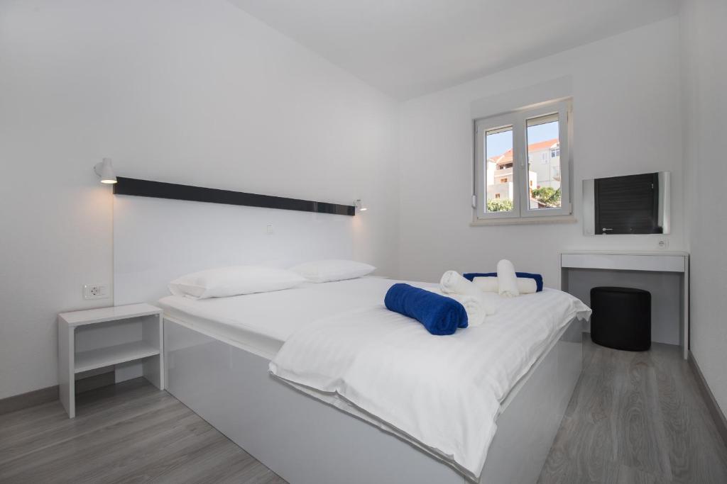 Posteľ alebo postele v izbe v ubytovaní Apartments BlueView