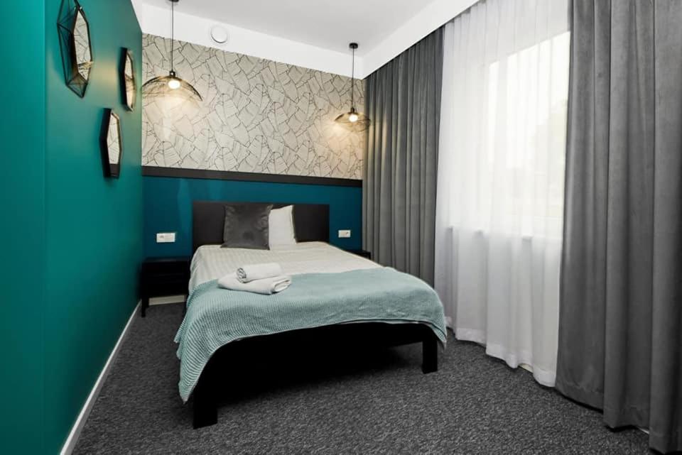 Posteľ alebo postele v izbe v ubytovaní Hotel Prowincja