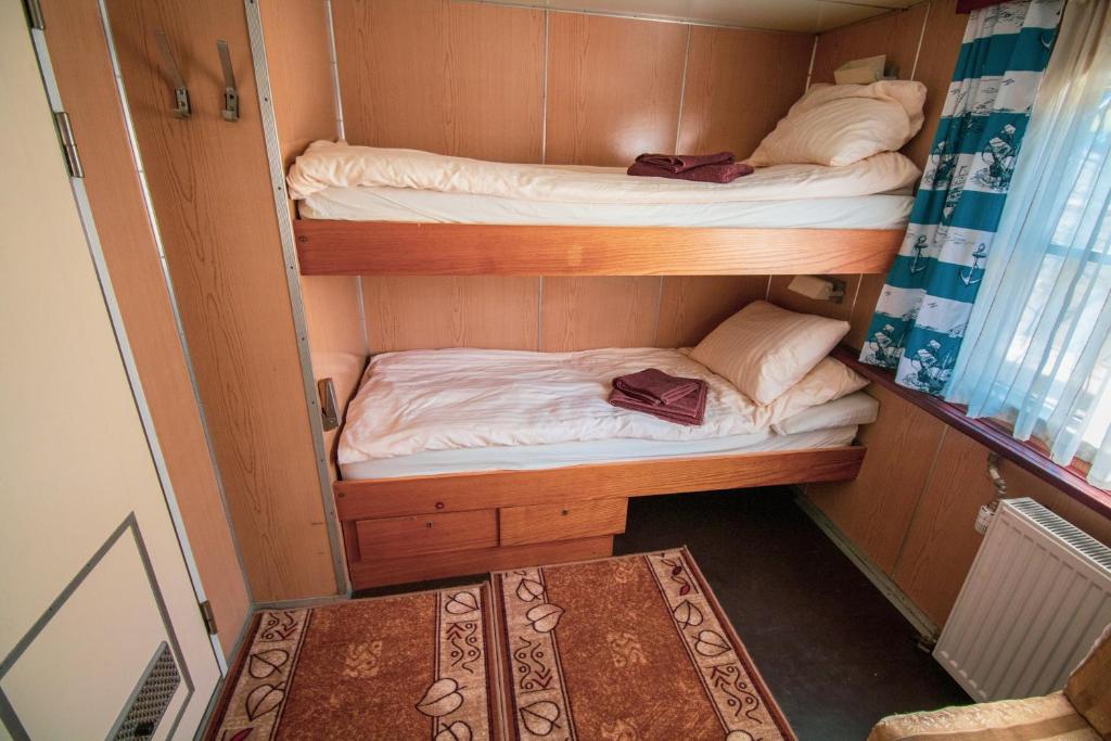 Postel nebo postele na pokoji v ubytování Barka Atena