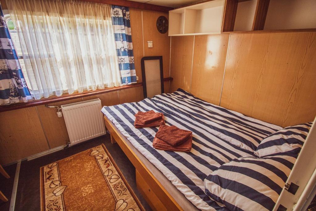 Postel nebo postele na pokoji v ubytování Barka Atena